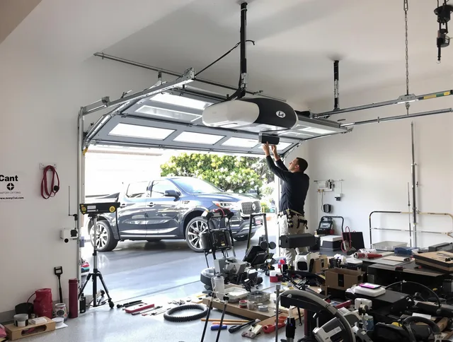 Port Orange Garage Door Repair specialist installing smart garage door opener system in Port Orange home